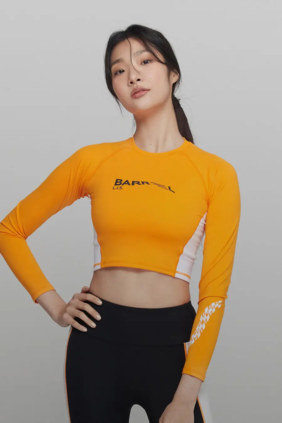 barrel_WomensMoveCropRashGuard_orange_image1