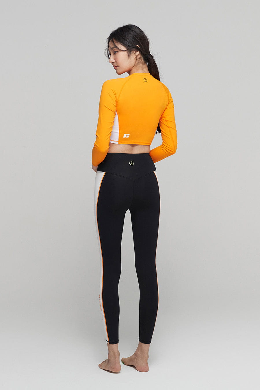 barrel_WomensMoveCropRashGuard_orange_image5